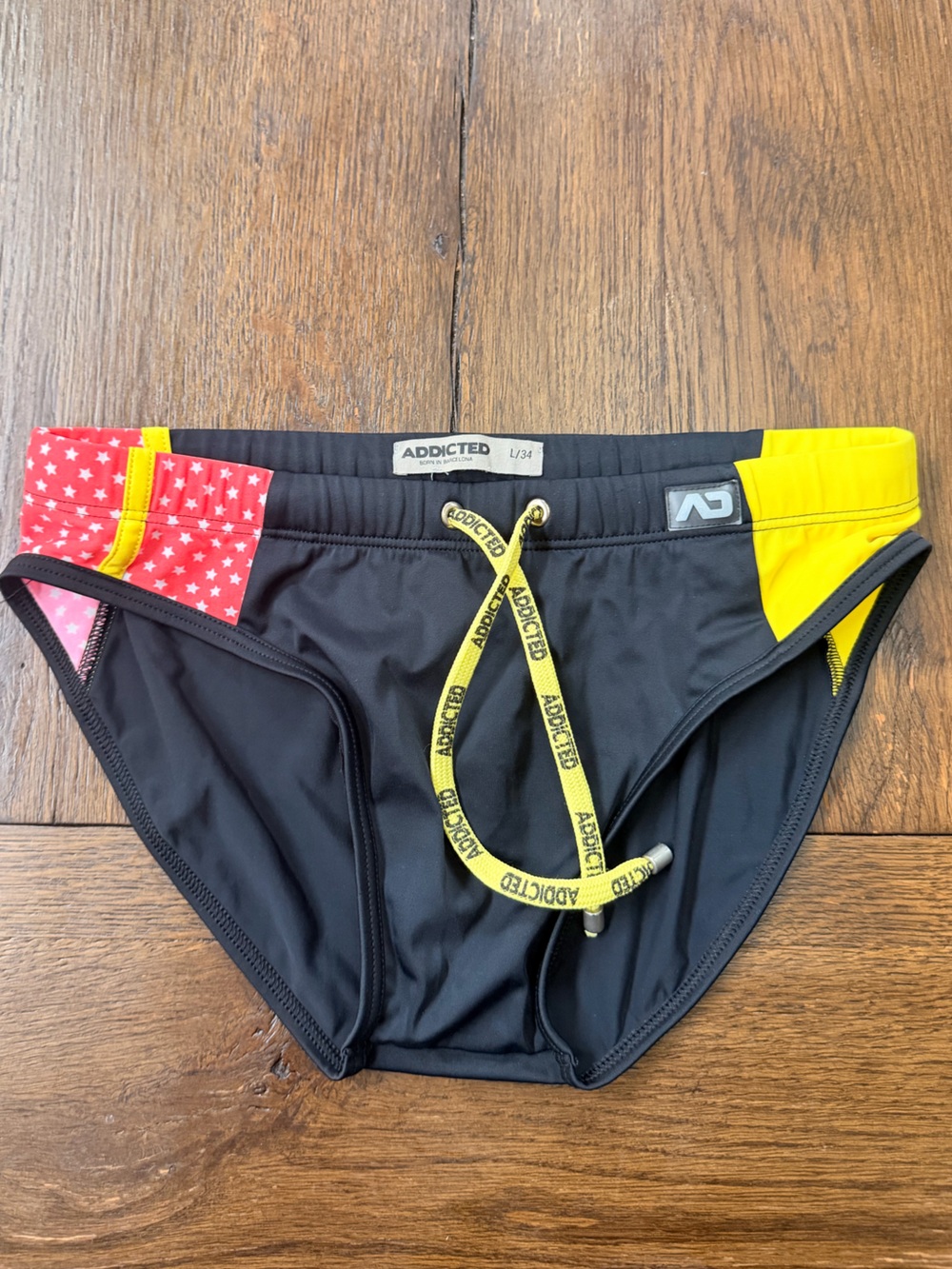 Addicted Brands Black Swim Trunks with Yellow Drawstring and Red Star Panel